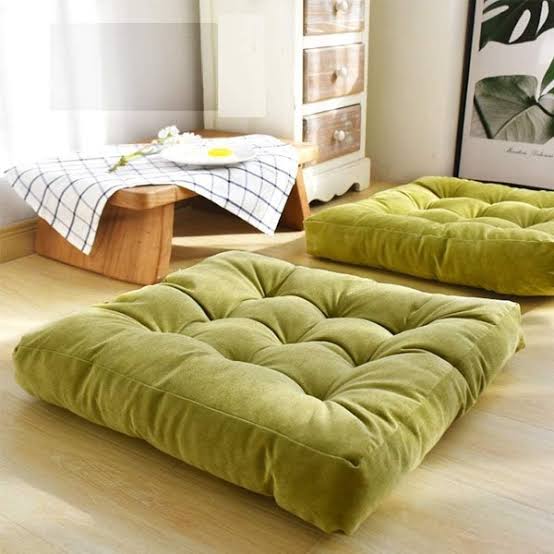 Soft throw pillows nearby with velvet and cotton covers